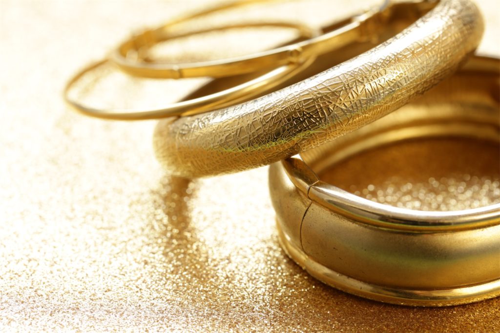 4 pieces of gold bangles on the table, which can be pledged at a pawn shop in Singapore