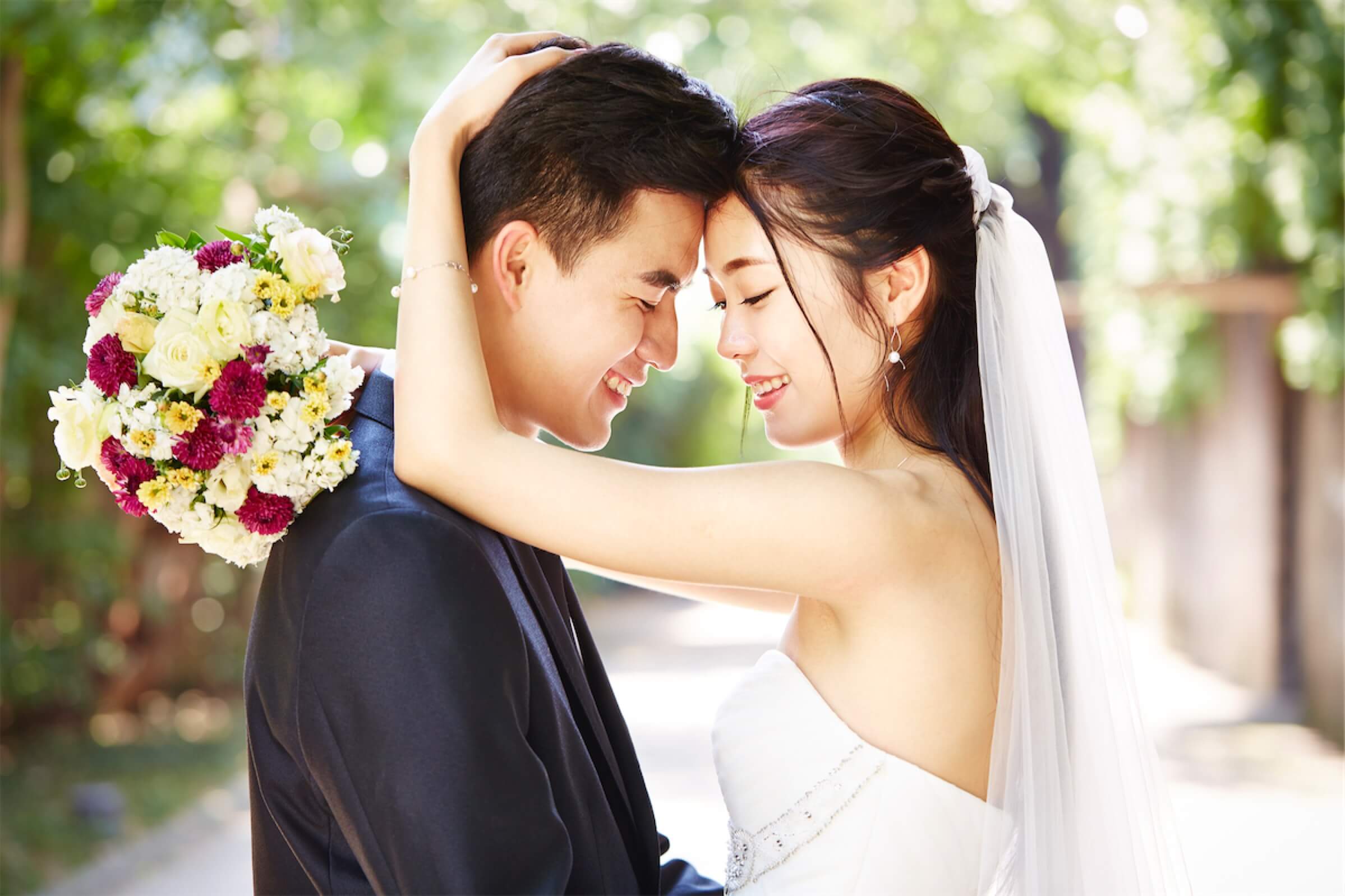 Asian couple on the day of their wedding, which can be funded by a personal loan in Singapore