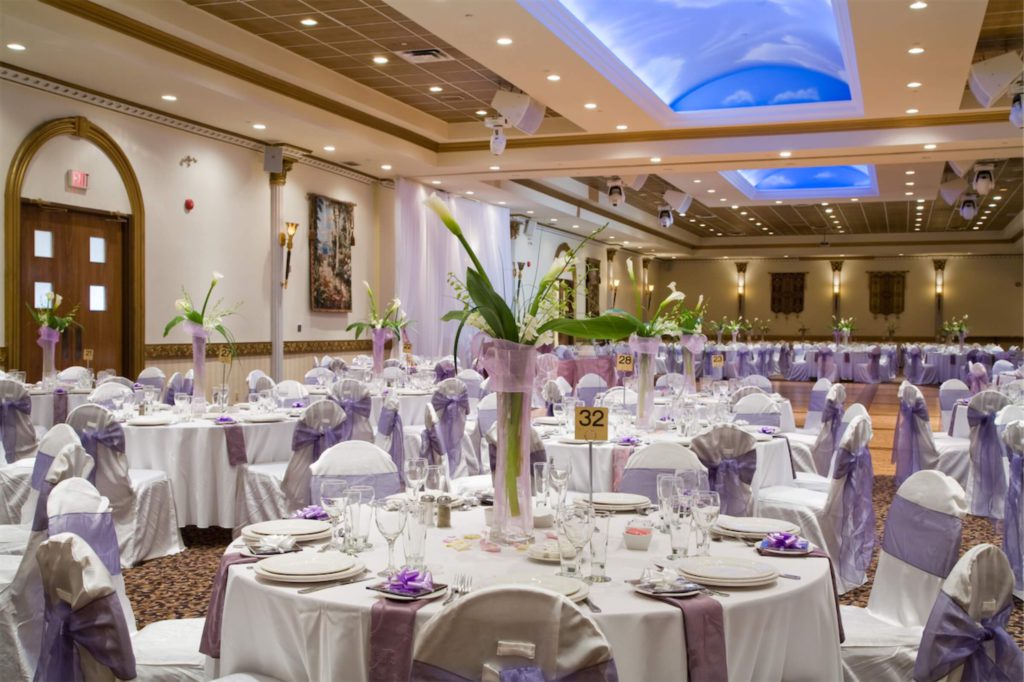 A hotel ballroom with a wedding banquet setting, which can be funded by a personal loan in Singapore