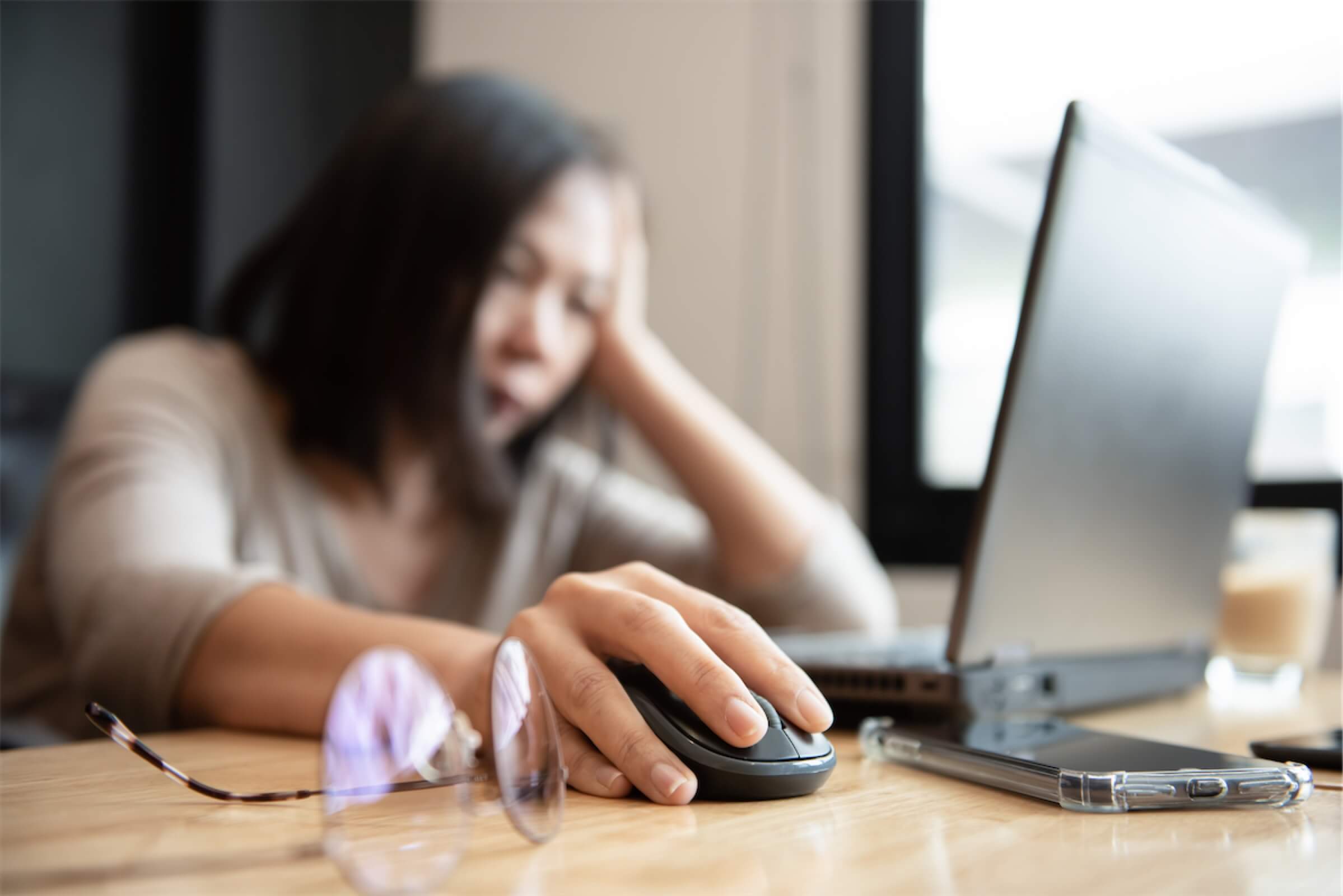 A woman feeling stressed over her personal loan application in Singapore as she is unemployed