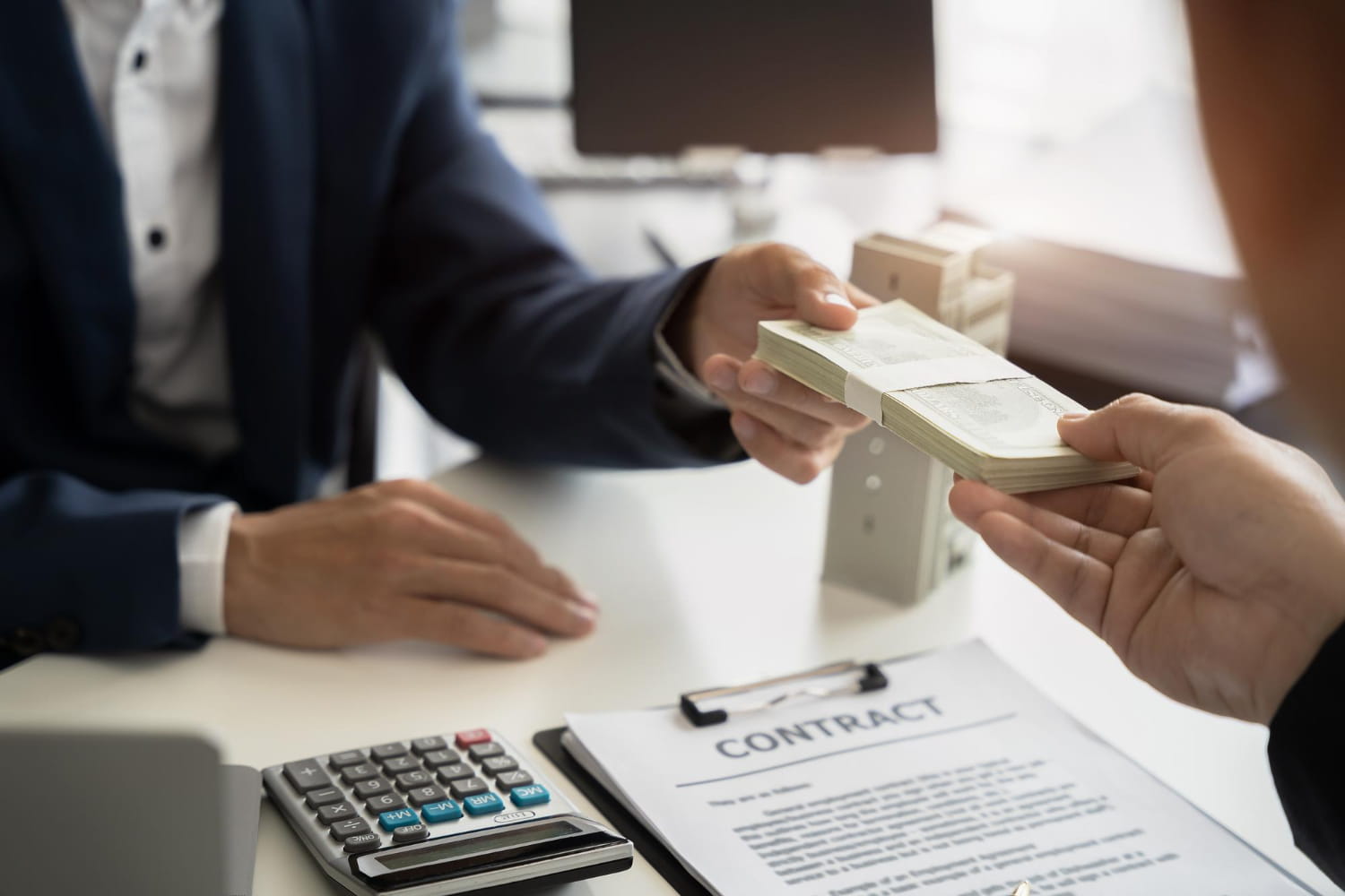 Handing cash over a loan contract