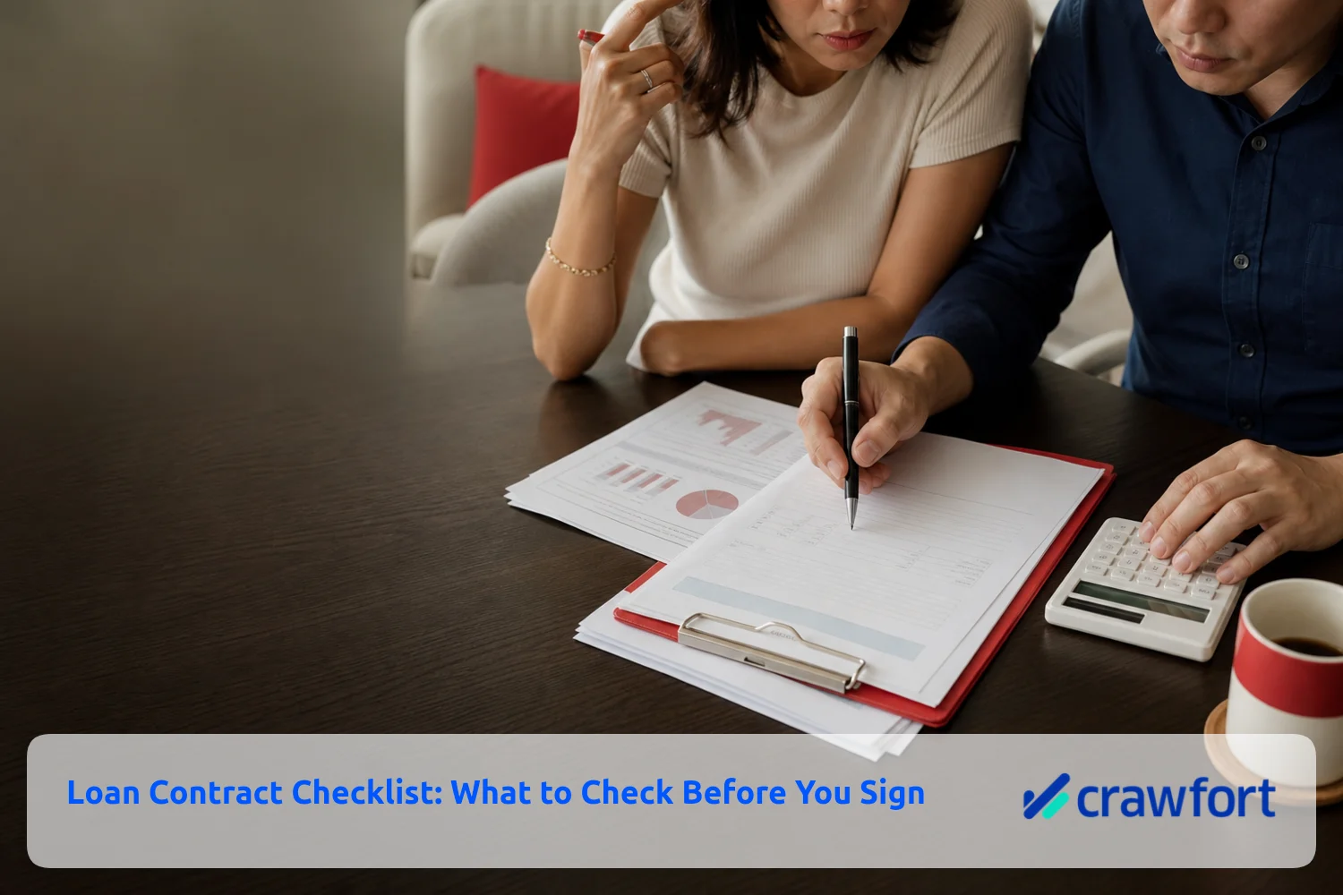 Borrower reviewing a loan contract, repayment schedule and calculator before signing